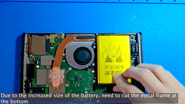 The difficult bit - making the new battery fit (Image Credit: Naga / YouTube)