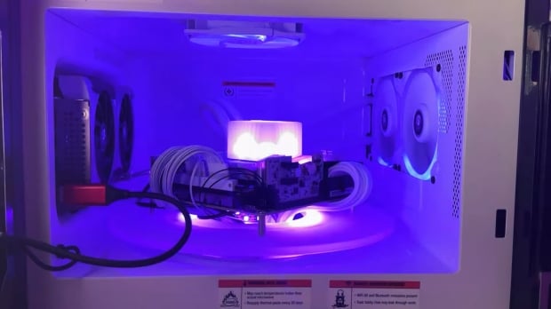 This microwave was modded into a gaming PC: rotates on a turntable, Stream Deck for keypad 703