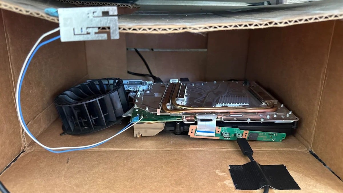 'Naked' PS5 Pro is the innards of the console in a cardboard box with a big fan blasting air through - and it works somehow