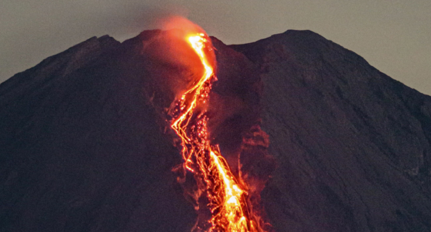 Open enlarged image Thousands flee erupting volcano spewing big columns of deadly hot ash