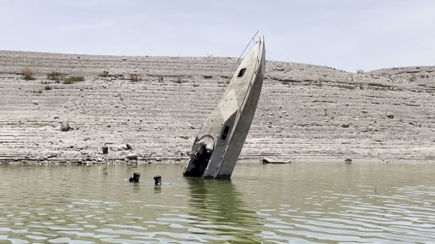 Open enlarged image Bodies and more surface as largest US reservoir hits all-time-low