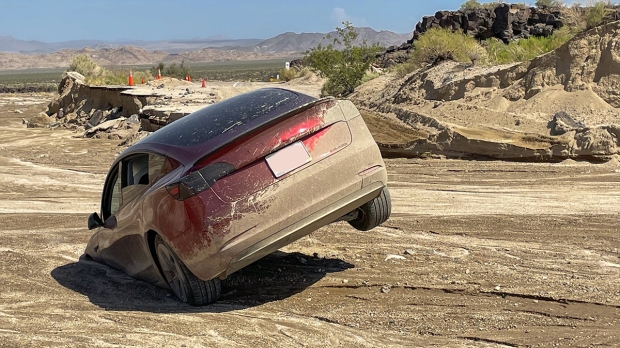 Open enlarged image Tesla gobbled up by the Earth after intense flash flooding