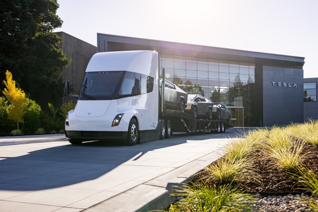 Tesla's new Cybertruck, sitting on the back of a Tesla Semi truck (source: Tesla)