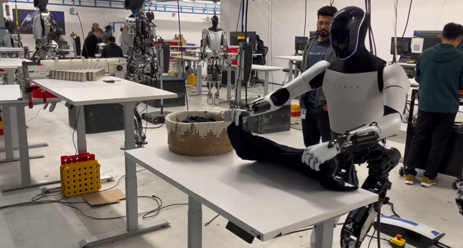 Elon Musk shares video of Tesla's humanoid robot folding a shirt better