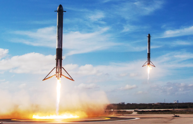 Two SpaceX Falcon Heavy side boosters caught landing in epic unison video